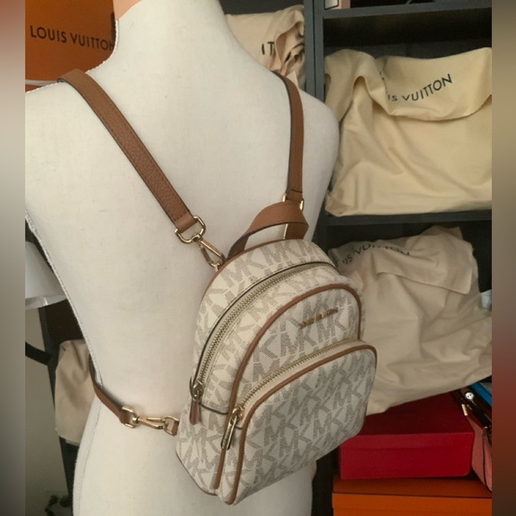 Micheal Kors Mini Backpack. Interior needs a little cleaning. No cosmetic issues - Picture 1 of 5